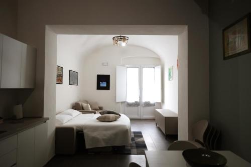 a bedroom with a bed and a living room at Caudium B&B in Montesarchio