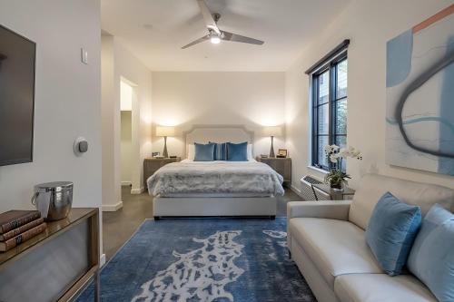 a bedroom with a bed and a couch at The 121 Hotel in Nashville
