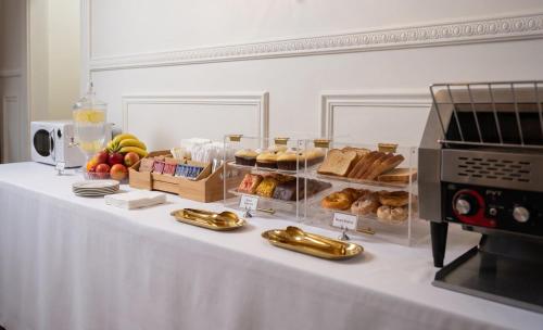 a table with bread and other food items on it at The Historic Grand Canyon Hotel in Williams
