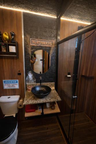 a bathroom with a sink and a mirror at Lumos Experience in Guaratuba