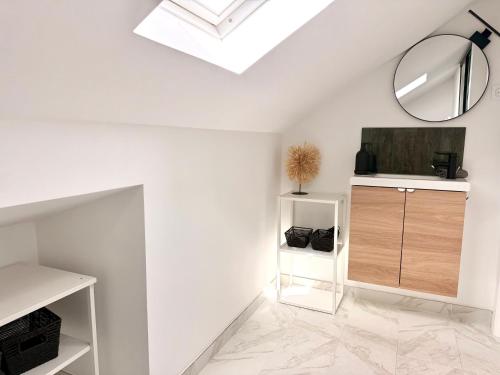 a white room with a skylight and a mirror at Casa Carlindo - Private Pool - Nature & Calm in Ferreira