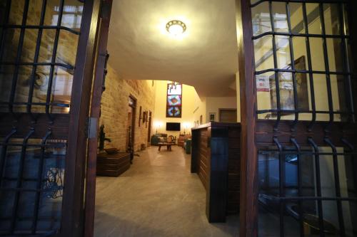 an open door to a hallway in a building at Asamina Boutique Hotel in Soûr