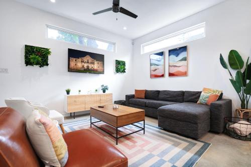 a living room with a couch and a table at Modern SA Home Nr DT River Walk Alamo WiFi in San Antonio