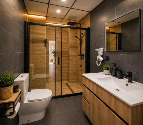 a bathroom with a shower and a toilet and a sink at Ohana Urban Málaga Centro in Málaga