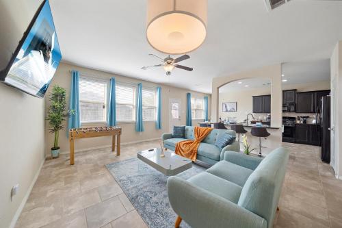 a living room with a couch and a table at Near IAH Houston Home Yard BBQ Games Wi-Fi Pets in Houston
