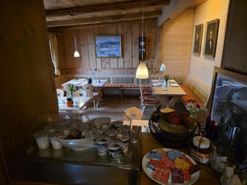 a living room with a table with food on it at Brend Hotel und Gasthof in Furtwangen