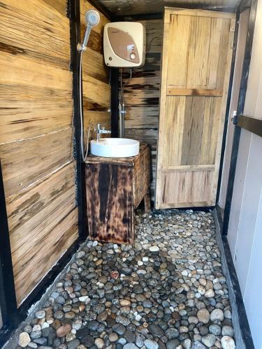 a bathroom with a sink and a toilet at Sơn Tra Our House in Bản Bé
