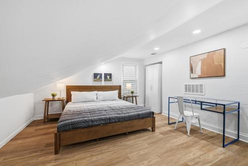a bedroom with a bed and a desk in it at Pittsburgh Millvale E Modern and Quiet Private Bedroom with Shared Bathroom in Pittsburgh