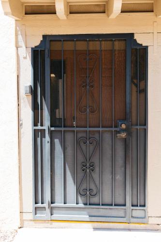 a window with a iron gate on a building at Desert Oasis Condo in Green Valley