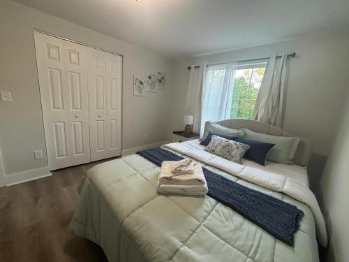 a bedroom with two beds and a large window at Cozy Rooms in Decatur in Decatur