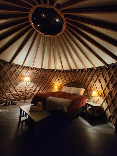 a bedroom with a bed in a yurt at Holly Hideaway in Cullowhee
