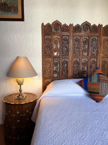 Tempat tidur dalam kamar di Avicena Hotel Boutique