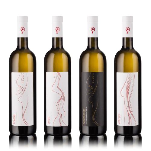 a group of four bottles of wine with labels at Hotel Landgasthof Weingut Seeperle in Caldaro