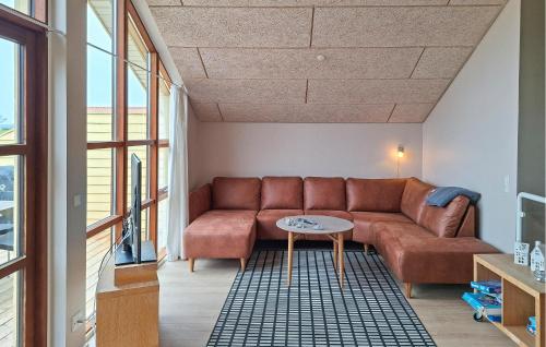 a living room with a couch and a table at Marina Minde in Egernsund