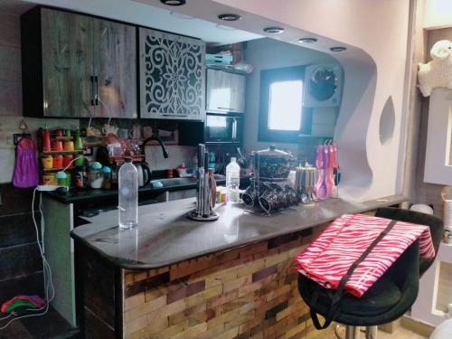 a kitchen with a sink and a counter top at Mazen Zakaria apartment in Port Said