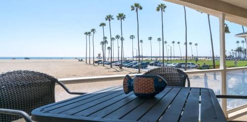 a table and chairs with a view of the beach at 1005 East Balboa in Newport Beach
