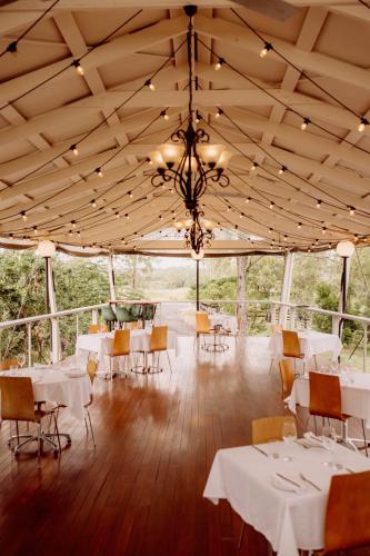 a dining room with tables and a chandelier at Boonah Valley Motel in Boonah