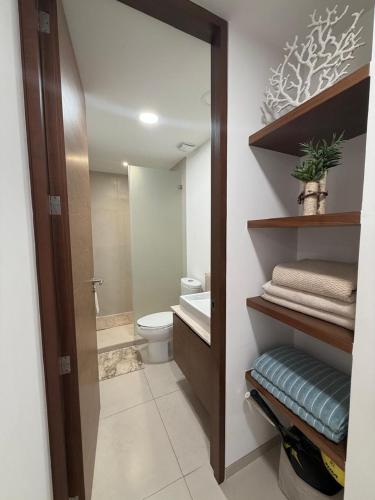 a bathroom with a toilet and a sink at Paradise in a rainforest reserve B 503 in Playa del Carmen