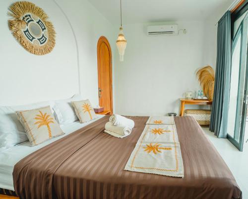 a bedroom with a large bed in a room at Hideout Kintamani and Hot Spring in Kintamani
