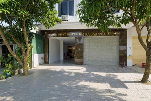 a building with a sign on the front of it at Hưng Phát Hotel Nghệ An in Vinh