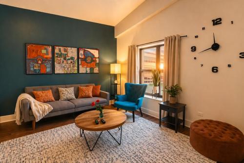 a living room with a couch and a table at McCormick Place 420 Friendly 3BR in Downtown Chicago with Optional Parking Sleeps 8 Guests Near Soldier Field, Grant Park and Lakefront Trail in Chicago