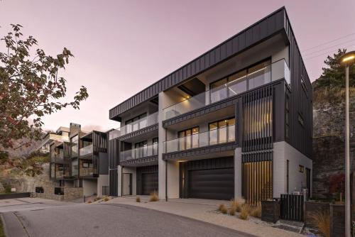 an apartment building with a black and white facade at Northview Residence in Frankton