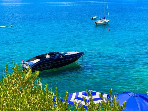 a boat in the water with boats in the water at Villa Olivija-in front of beach! in Stara Novalja