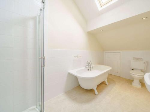 a white bathroom with a sink and a toilet at 3 Bed in Poulton-le-fylde oc-41764 in Preesall