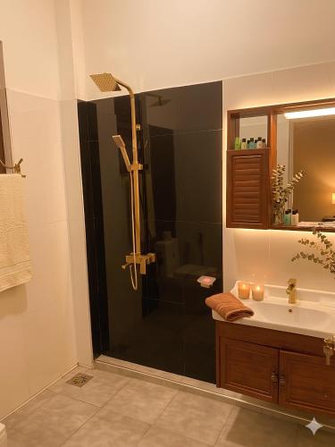 a bathroom with a shower and a sink at H M C Leisure Villa Devinuwara in Dondra North