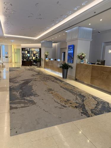 a large lobby with a large floor in a building at Paradox Sydney in Sydney