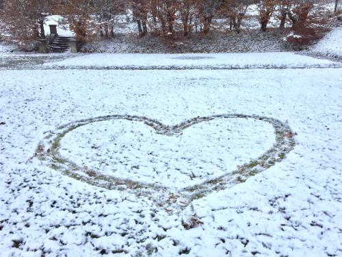 a heart drawn in the snow on a yard at Zabola Estate - Transylvania in Zăbala