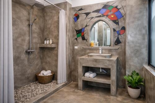 a bathroom with a sink and a shower at Midtown homestay in Phong Nha