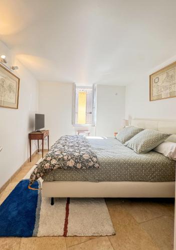 Llit o llits en una habitació de Le Petit Prieuré