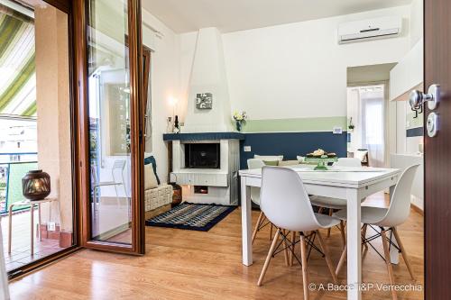 a dining room with a table and a fireplace at Mint House in Vasto