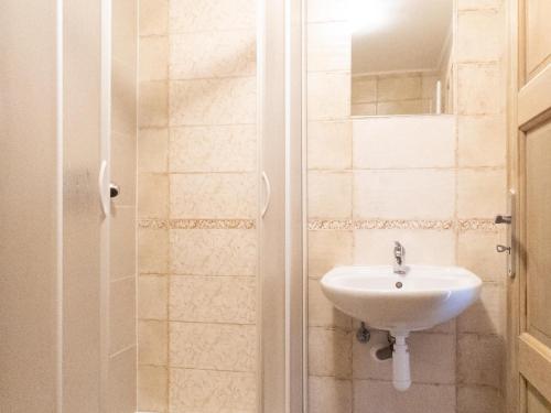 a bathroom with a sink and a shower at Apartmán Dvojka in Benecko