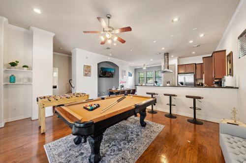 a living room with a pool table and a kitchen at Near DT, Heights, Washington WiFi Games BBQ in Houston