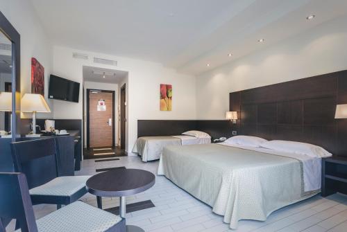 Postel nebo postele na pokoji v ubytování Hotel Principe Residence