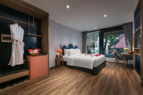 a hotel room with a bed and a fireplace at Solar Premium Hotel & Spa in Hanoi