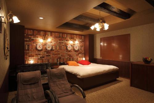 Un ou plusieurs lits dans un hébergement de l'établissement Hotel Water Gate Tajimi