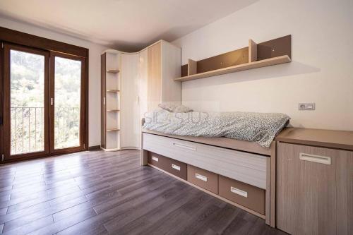 a bedroom with a bed on a dresser at Pomar By Silastur in Obaya