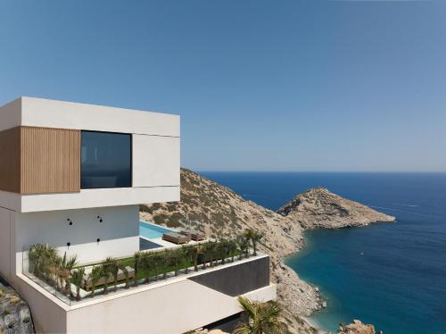Seafront Cliff Villa with Infinity Pool & Wellness, By ThinkVilla