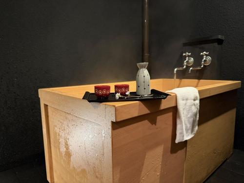 a bathroom with a counter with a sink at Senbonzakura Yoshino in Yoshino