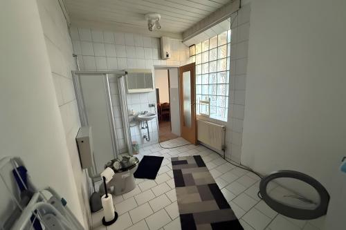 a small bathroom with a toilet and a sink at Viel Platz und Komfort in Orbis