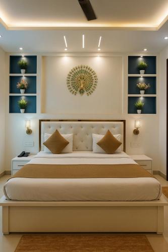 a bedroom with a large bed with blue shelves at The Mayur Resort # Big Swimming Pool # Luxury Rooms # Garden # Playing Zone # Away From City Hustle # Property Of The Year # By Elegance # in Vrindāvan
