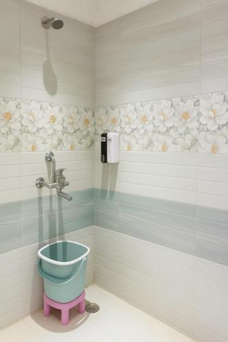 a bathroom with a toilet and a shower at The Mayur Resort # Big Swimming Pool # Luxury Rooms # Garden # Playing Zone # Away From City Hustle # Property Of The Year # By Elegance # in Vrindāvan