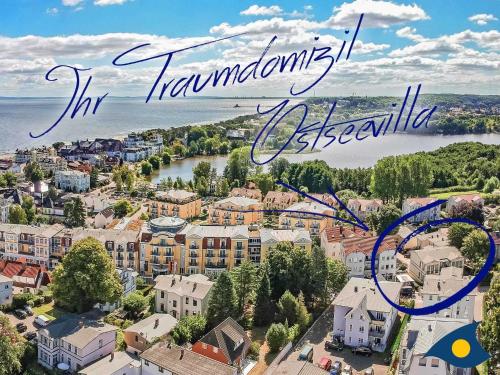an aerial view of a town with a river and houses at Ostseevilla Whg 01 in Bansin