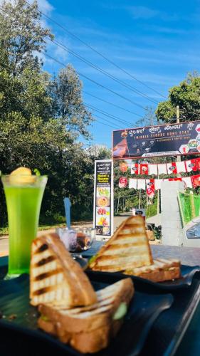 two slices of bread on a plate on a table at Twinkle Clouds Home Stay in Chikmagalūr
