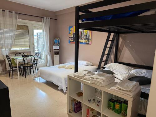 a bedroom with a bunk bed and a table at Stura Home in Rome