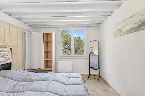 En eller flere senge i et værelse på Location Gîte Les Iris