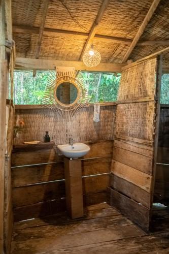 a bathroom with a sink and a mirror at Kactus - Your Island Sanctuary in Koh Ta Kiev